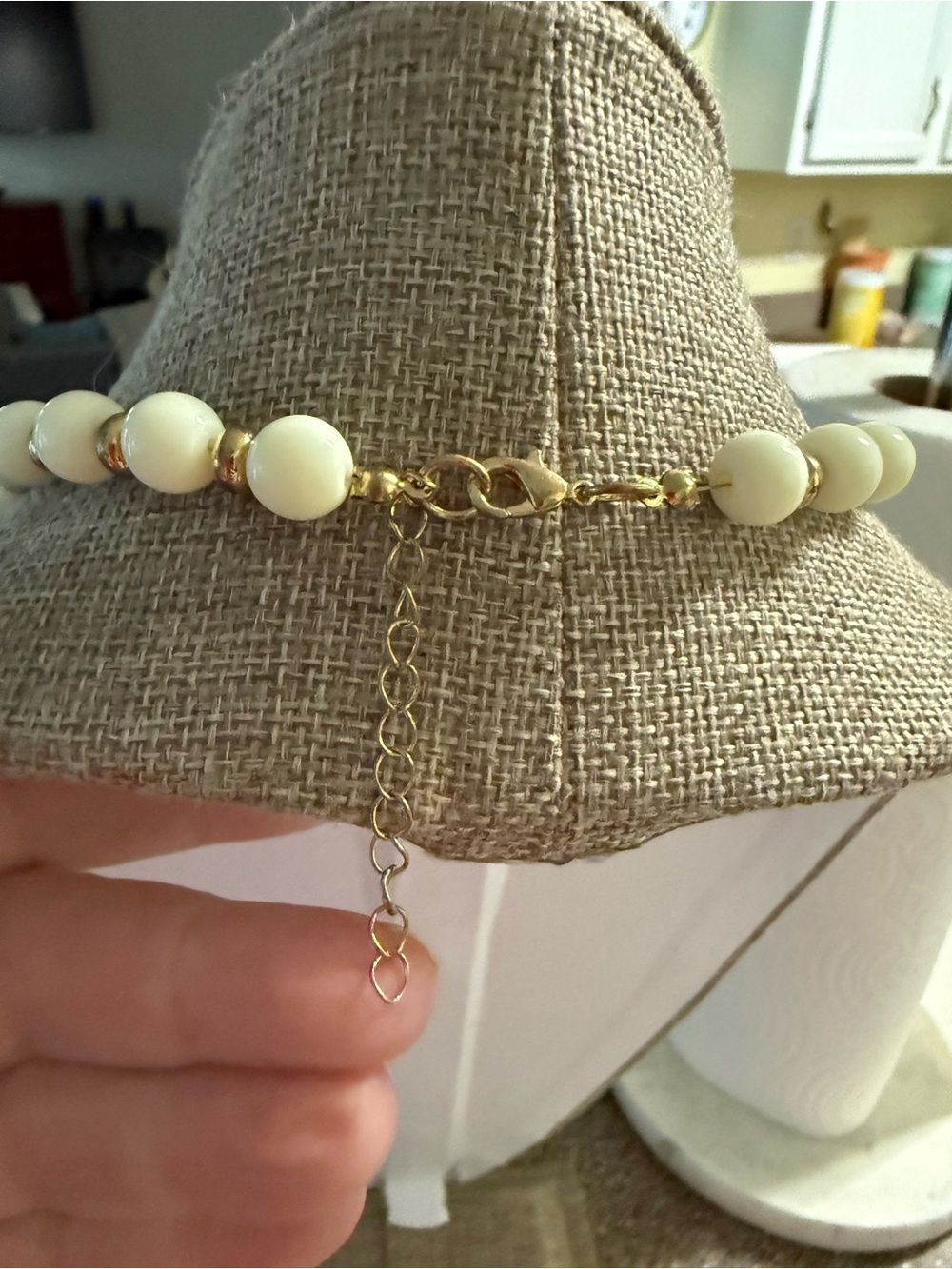 White Beaded Necklace with Gold Accents and Multicolor Swimmer Charms - Picture 5 of 10